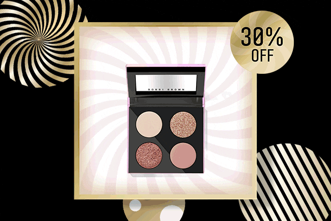 Snow globe with gold snow on a gold swirl background